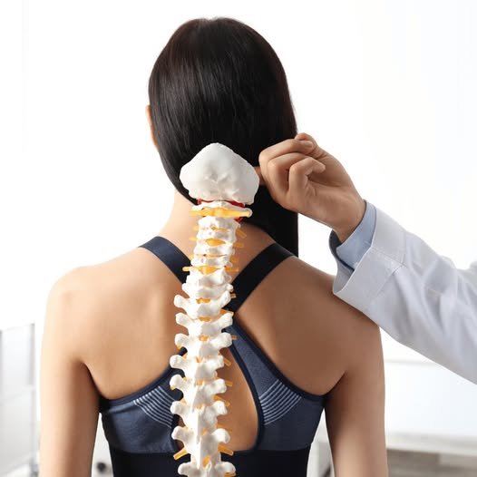 Dr. Jeffrey Moore consulting with patient about spine treatment in Oklahoma City